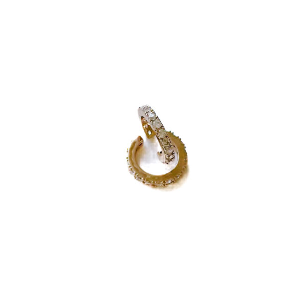 "High-resolution image of Light earcuff - Shine brighter than ever with our Light Earcuff. It's a unique piece that's perfect for those who love to stand out. Details: Sterling silver 925 Pure white zirconias No drilling required. Sold individually. Adjustable to the ear for a better fit. "